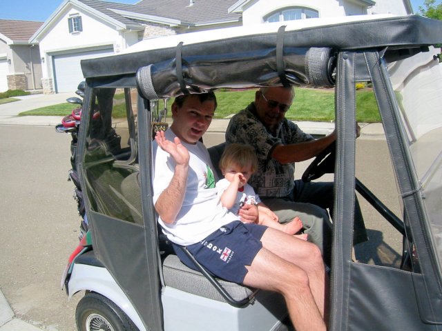 lilianddaddygoforarideinthegolfcartwithgrandpadon.jpg